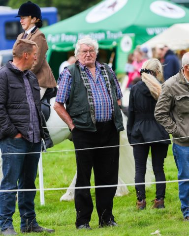 looking grumpy at a horse show brand clothing photographer gloucestershire
